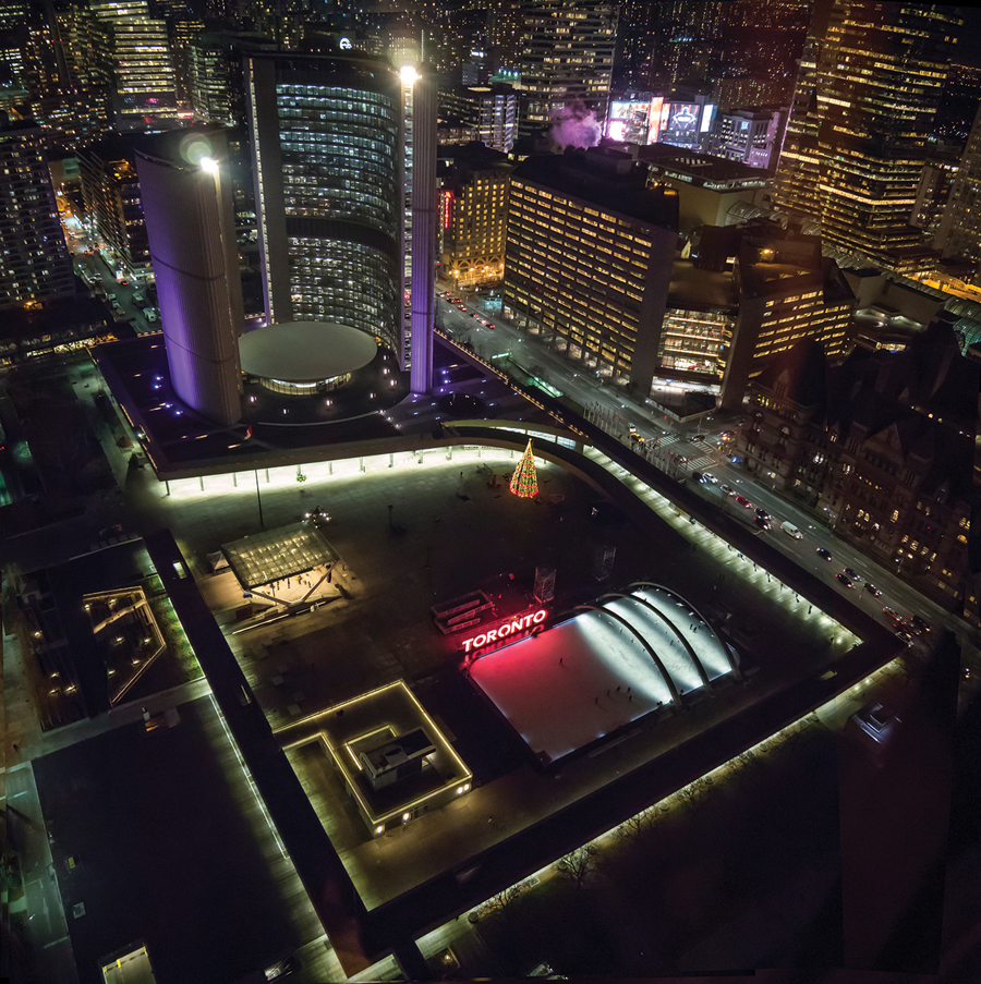 The revitalized Nathan Phillips Square includes the renewal of infrastructure underneath the plaza, as well as the addition of a new theatre, skate and snack pavilion, relocated Peace Garden, and an extensive green roof on the podium. Landscape and seating areas at the perimeter encourage movement under the surrounding walkways and into the Square. Photo by Chris Pommer.
